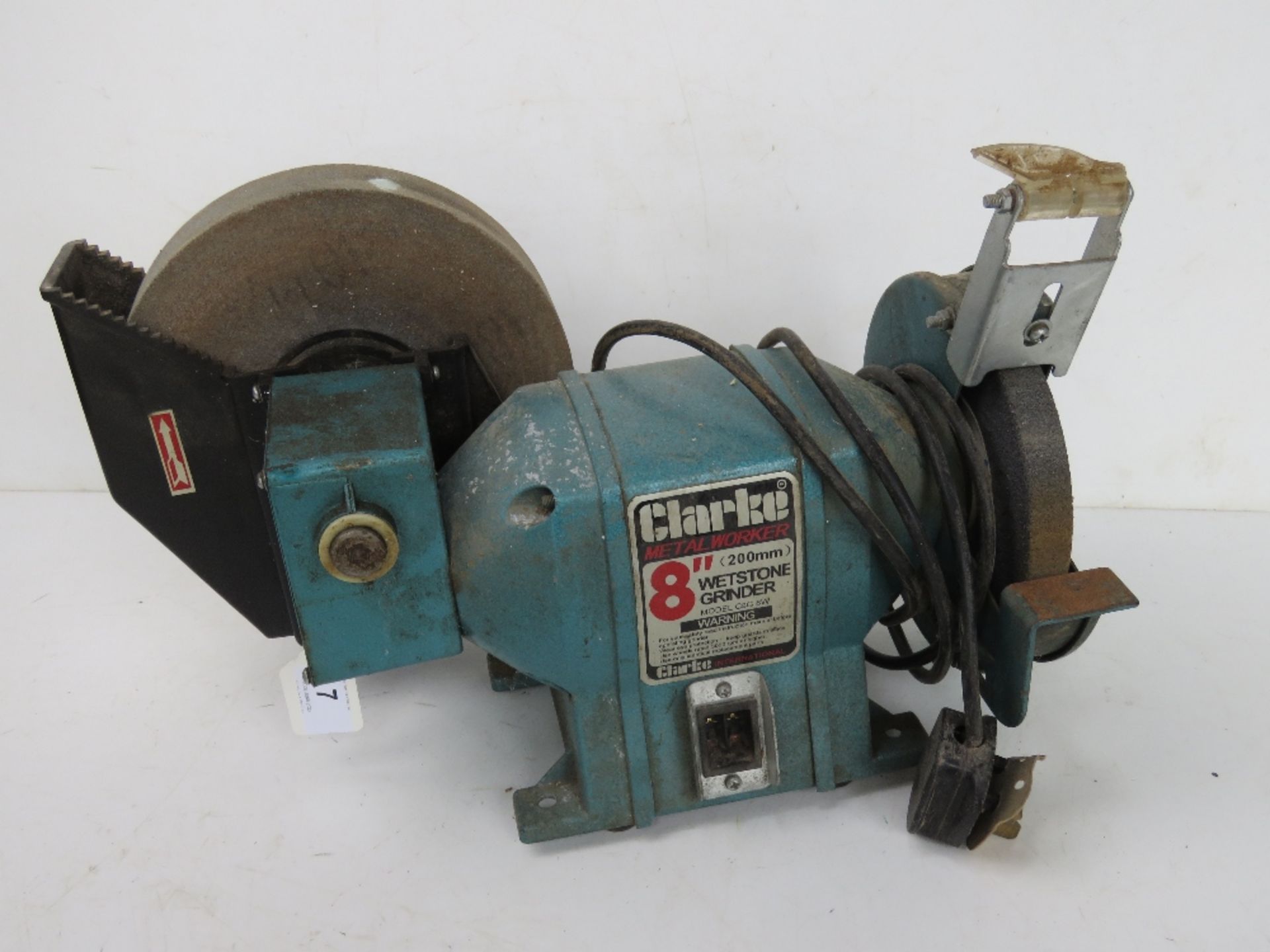 A Clarke metalworker wet stone grinder.