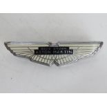 An enamelled metal Aston Martin car badge.