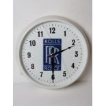 A c1960s Smiths 12" dial wall clock having Rolls Royce motif upon and later fitted quartz movement.