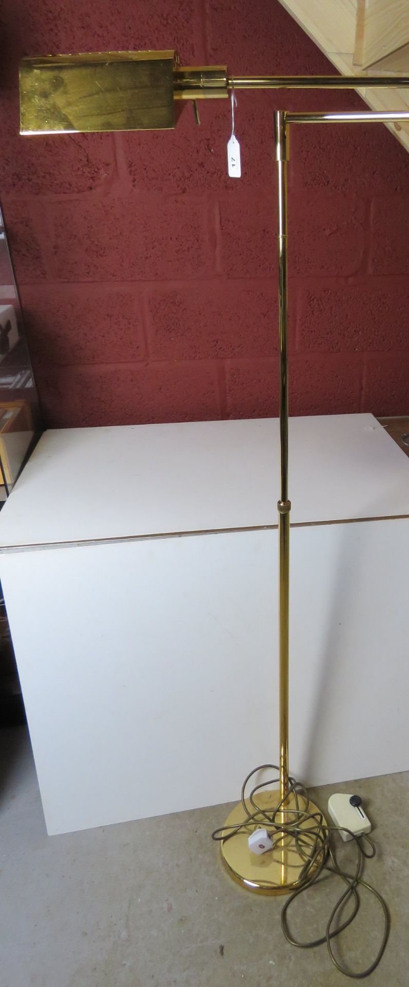 A mid century Italian made brass cantilever adjustable height floor lamp.