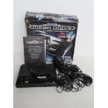 A Sega Mega Drive with instructions, cable and controllers in original box, box a/f.