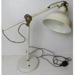 A white painted metal contemporary angle poise style table lamp.