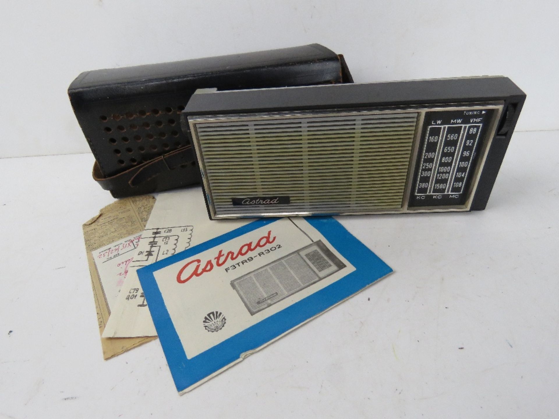 An Astrad radio with case and instructions.