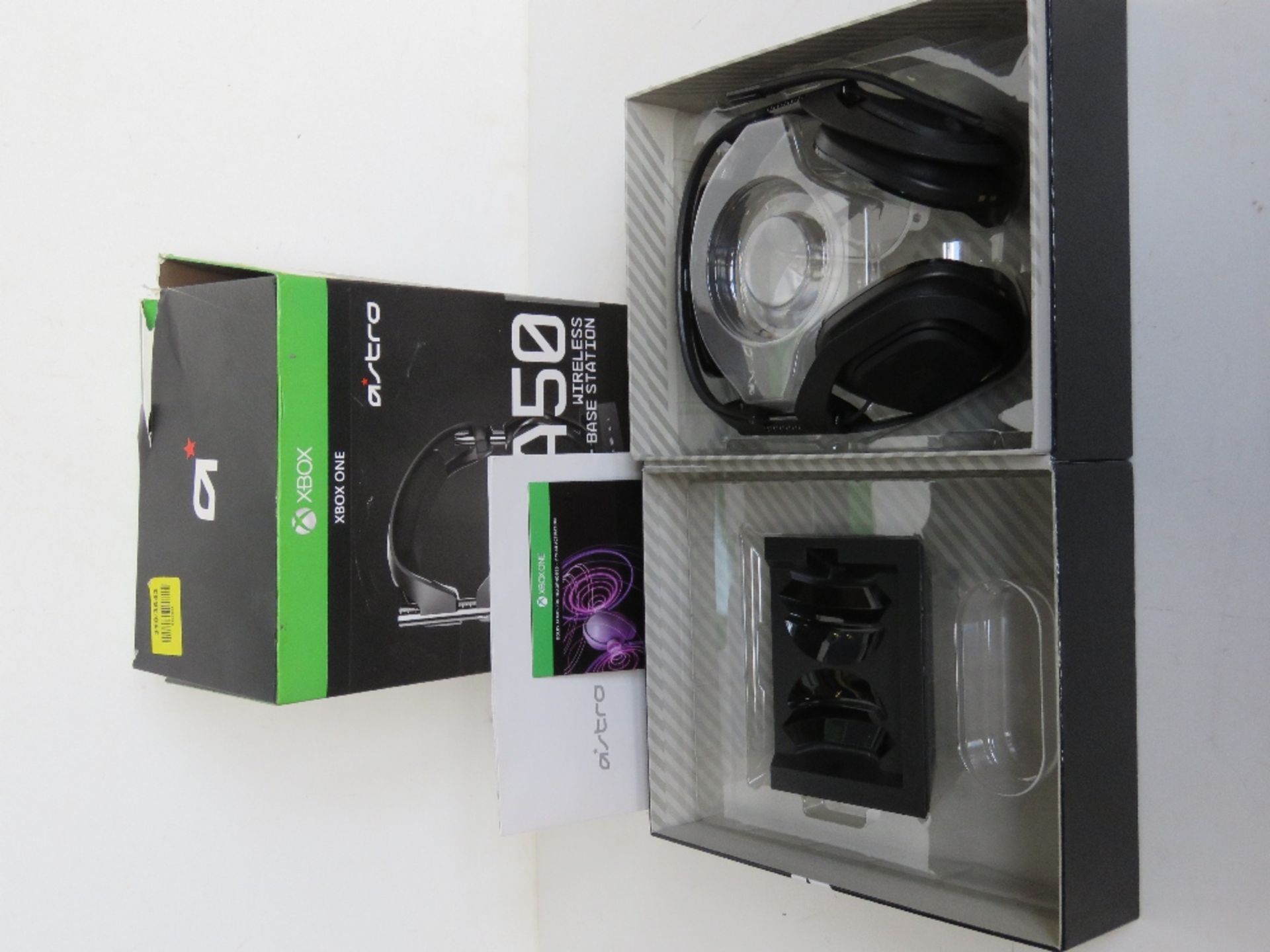An Astro A50 wireless headset and base station, no pads, in original box, box outer a/f.