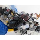 A large quantity of assorted camera accessories.
