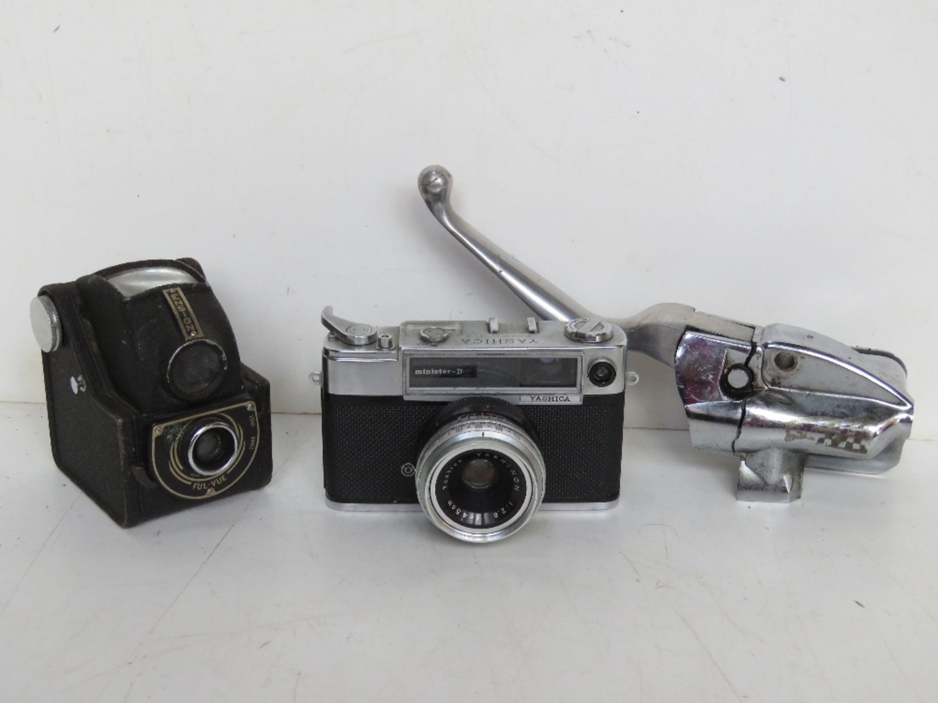 A Yashica MD5042450 camera together with two other items.