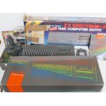 A Sinclair ZX Spectrum +2 with controller and games in original box, boxes showing signs of wear,