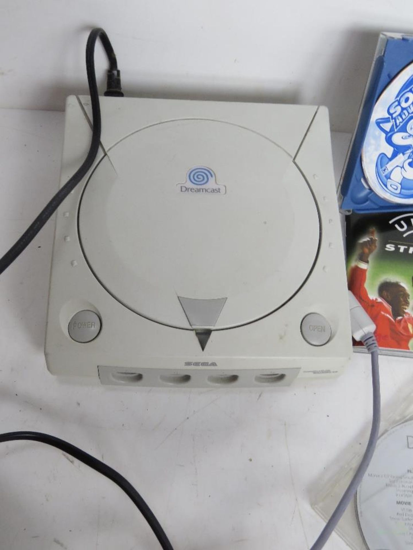 A Dreamcast console with controller and games. - Image 2 of 2