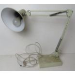 A white painted metal angle poise style table lamp.