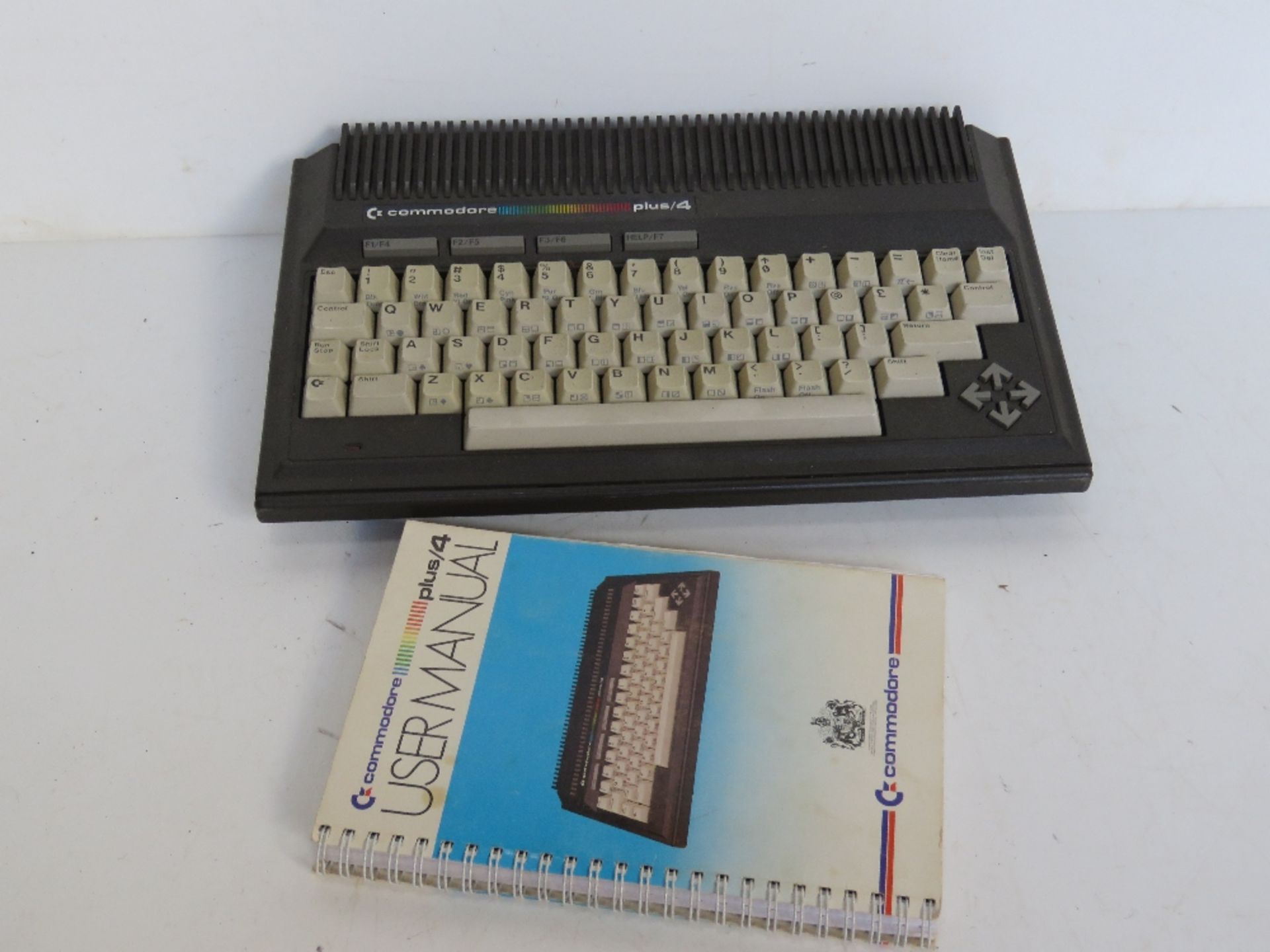 A Commodore plus/4 with user manual, no cables.