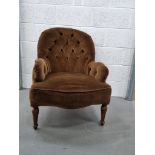 A fine green upholstered spoon back fireside chair.