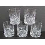 A set of five cut glass whisky tumbler.