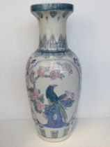A floor standing vase (umbrella stand) having Oriental influence pattern upon, standing 62.5cm high.