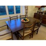 A 'Younger Toledo' Spanish style extending dining table with built in folding leaf,