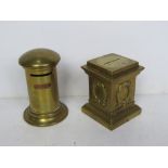 Two brass money boxes one in the form of a post box the other in the form of a Regency column.