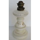 A Victorian milk glass oil lamp having gilt and blue hand decoration upon. No shade or chimney.