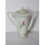 An early 20th century Royal Worcester teapot having single tulip pattern handpainted upon,