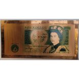 A large copper Bank of England 'One Pound Note' measuring approx 90 x 45cm.