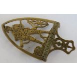 A brass iron trivet 'A gentleman in Khaki' approx 16.5cm in length.