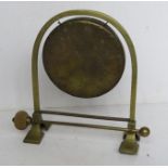 A brass table top dinner gong with mallet, standing 25.5cm high.