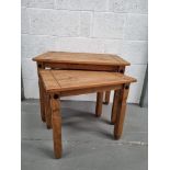 A nest of two pine tables.