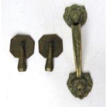 A delightful pair of Arts & Crafts drawer handles together a brass lion's mask pull handle.