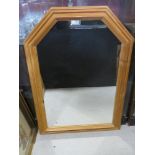 A large pine framed mirror 90 x 63 cm.