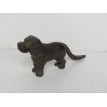 A cast iron nut cracker in the form of a dog.