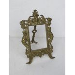 A brass easel back picture frame standing 25.5cm high, no glass.