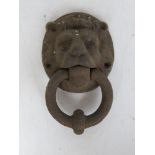 A cast iron Lion head door knocker