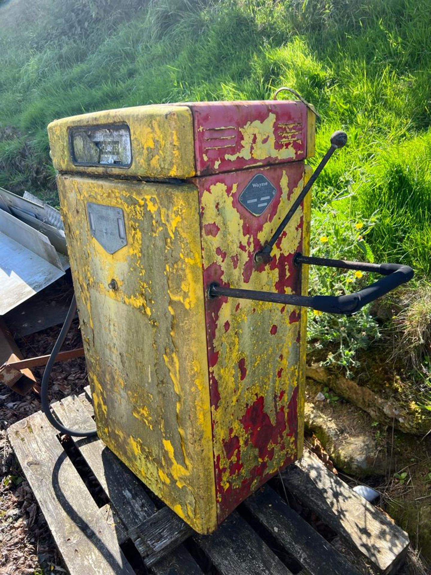 A vintage Shell 2T petrol pump in barn find condition.