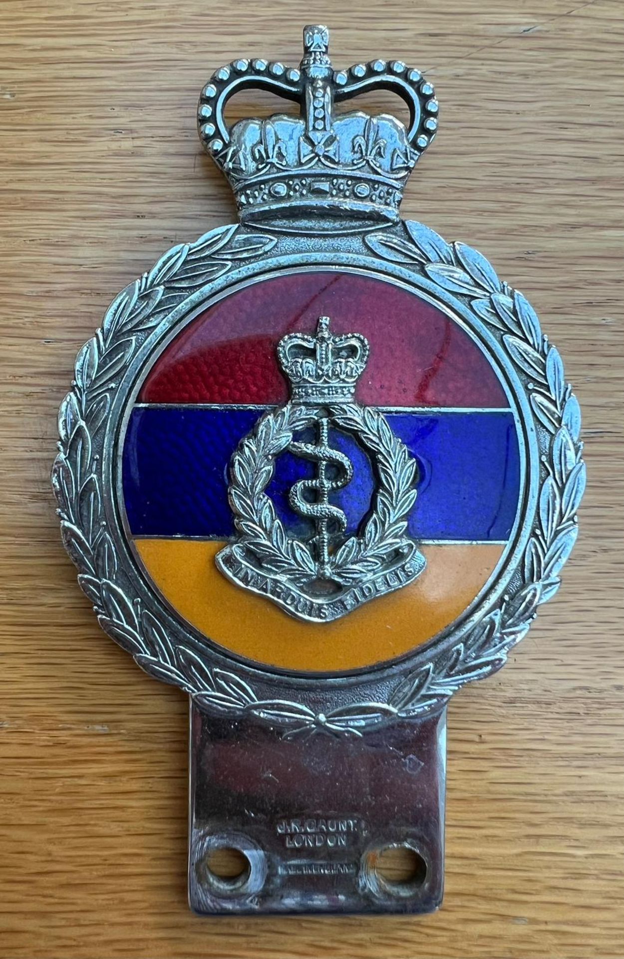 A Royal Army Medical Corps enamelled and chromium grill badge, bearing legend 'In Ardius Fidelis'