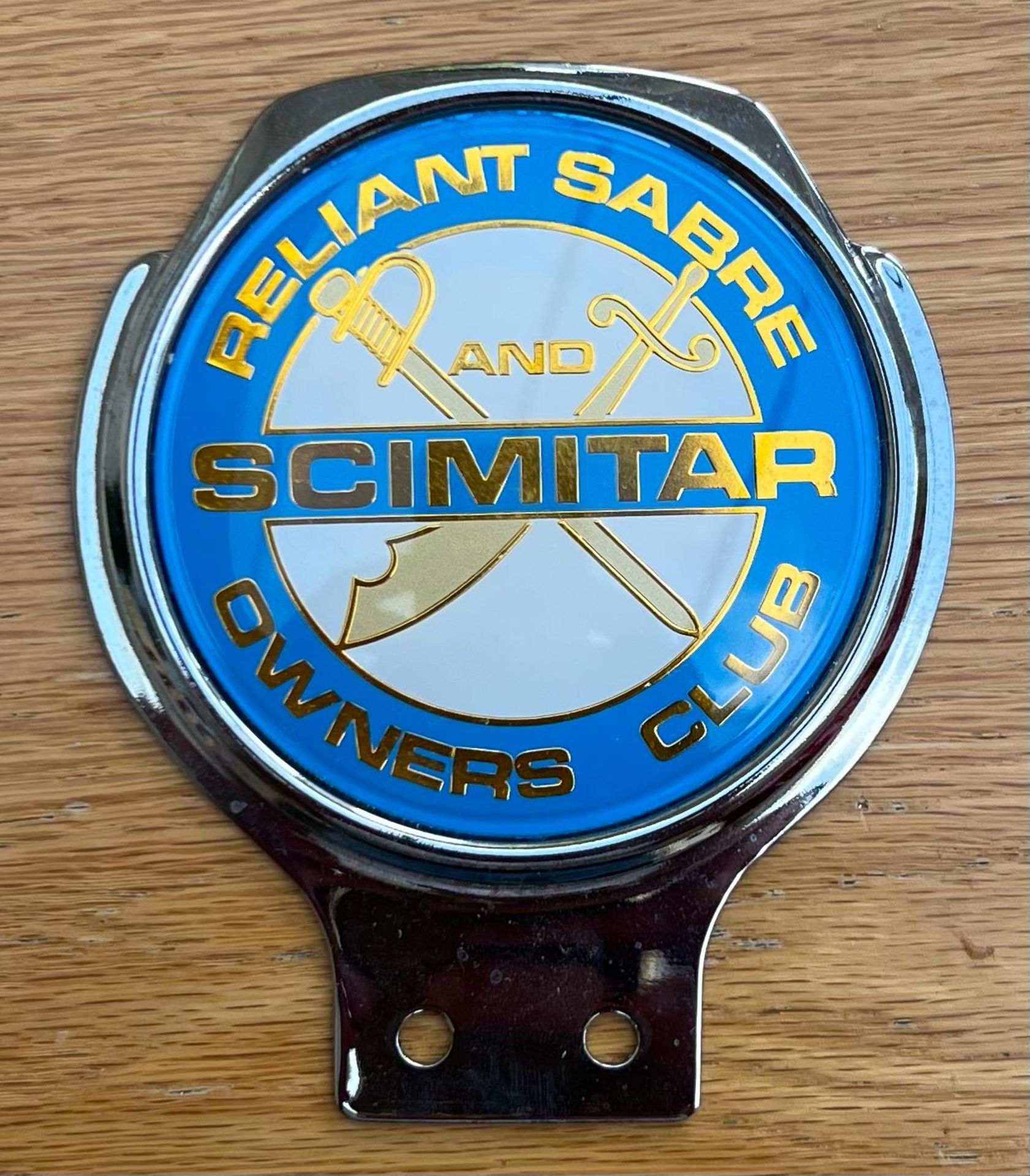 A rare Reliant Sabre & Scimitar Owners Club grill badge by Renamel of London. Measuring 11cm high.