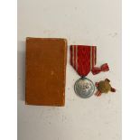 A WWII Japanese red cross medal and lapel badge in box. This lot will be available to collect in