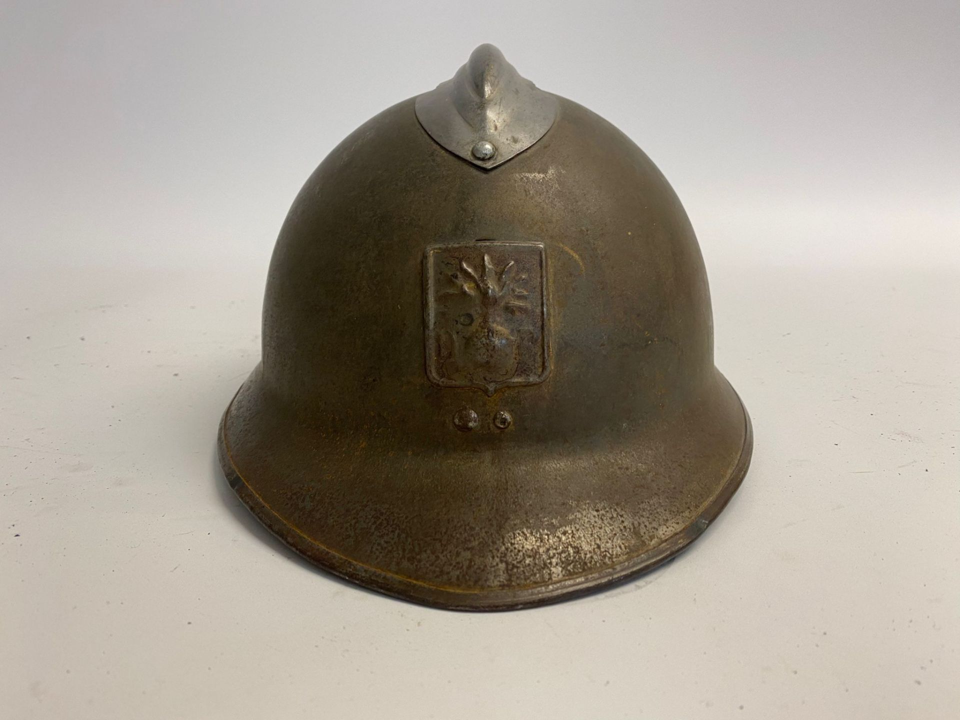 A French civil defence M26 Adrian helmet. This lot will be available to collect in person 48 hours