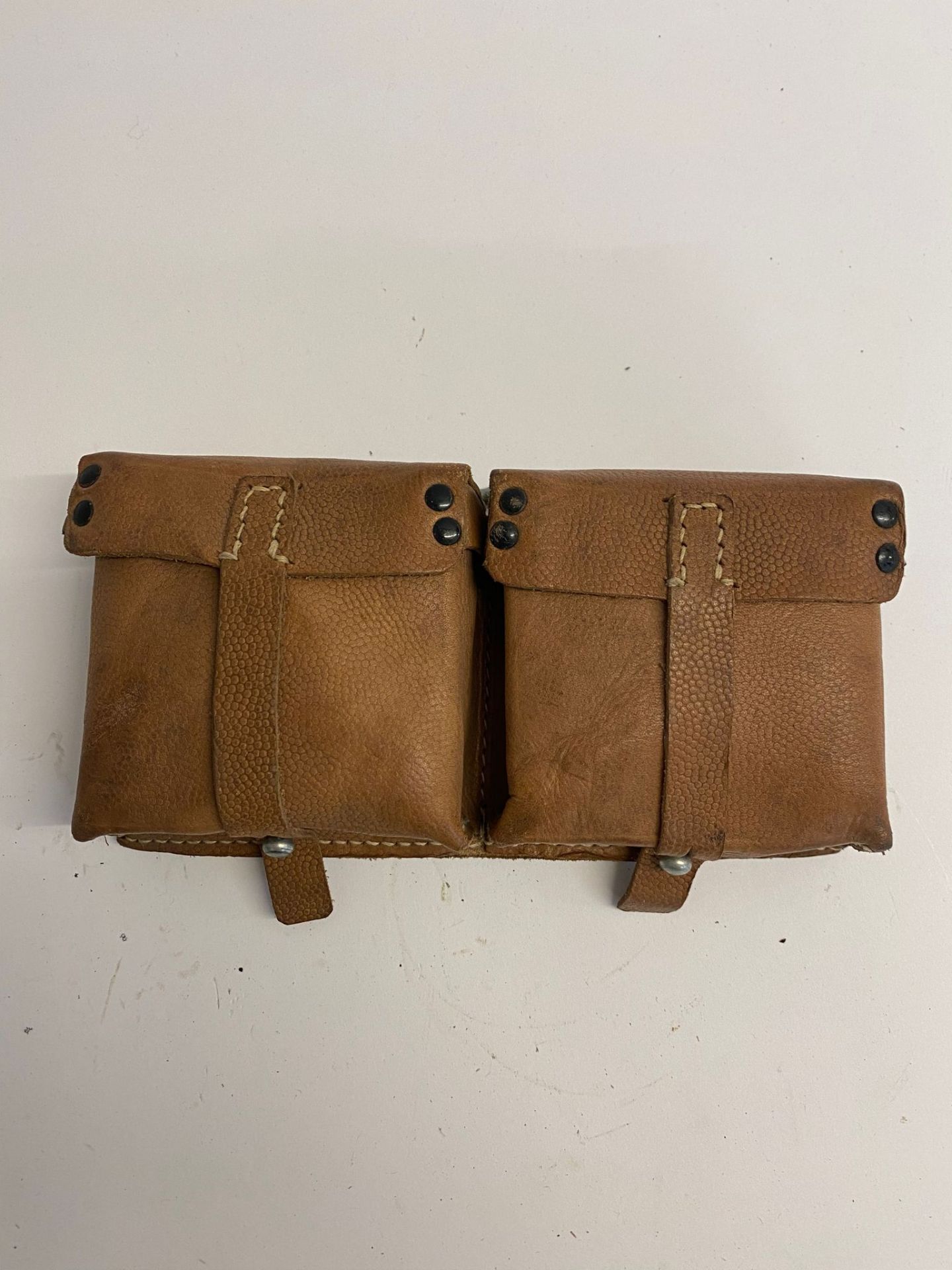 A WWII German G43/K43 ammo pouch having 'ros' maker mark and dated 1944. This lot will be