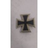 A WWII German iron cross badge bearing mark to pin. This lot will be available to collect in