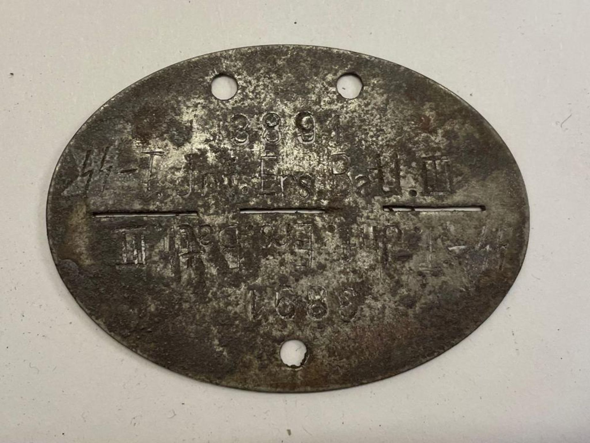 A WWII German Waffen-SS infantry battalion dog tag. This lot will be available to collect in