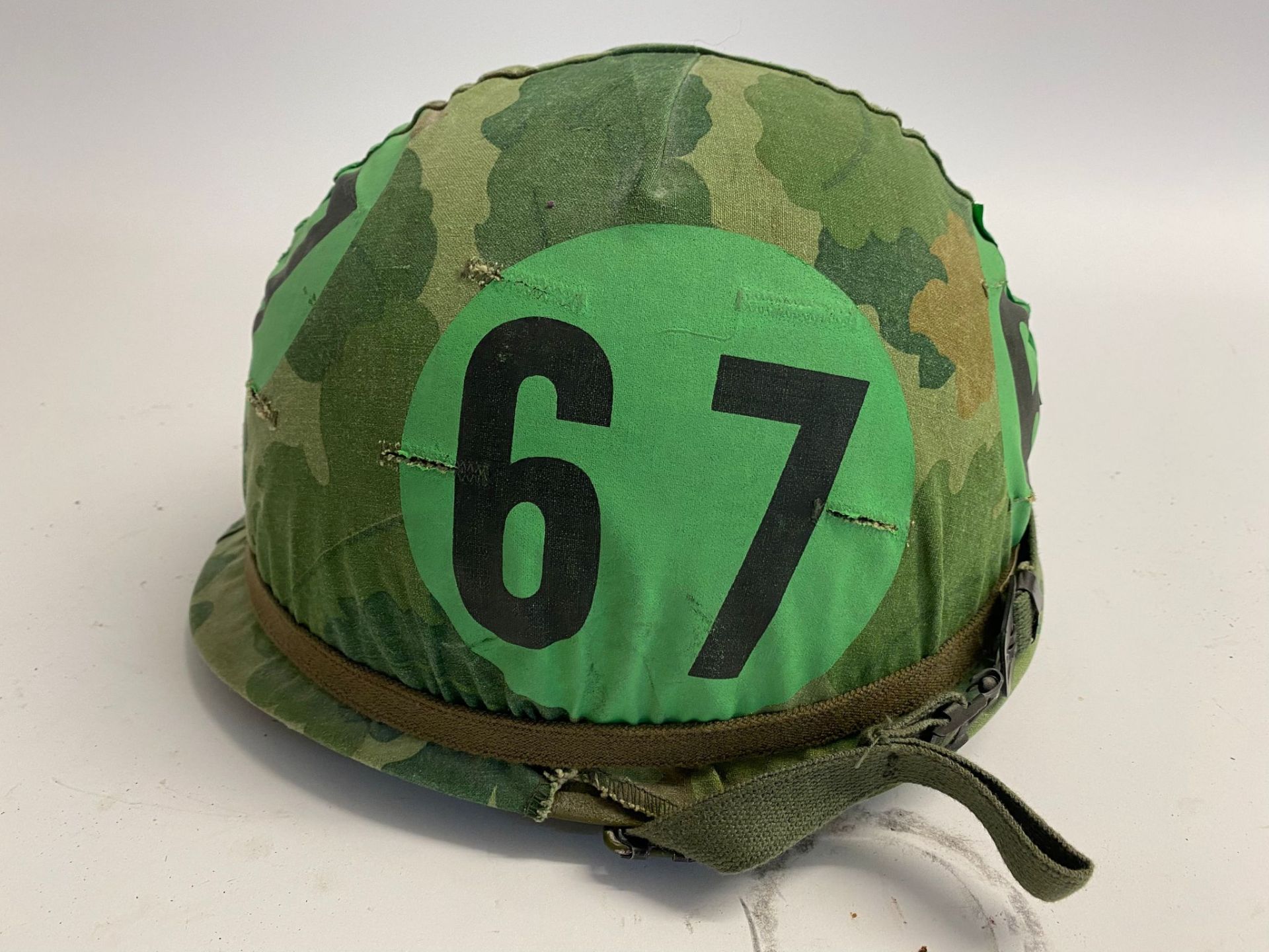 A US M1 airborne training helmet with embroidered band bearing the name Davidson. The cover with - Image 2 of 6