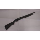 A deactivated (EU Spec) US Mossberg Maverick model 88 pump action shotgun with solid stock and