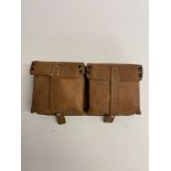 A WWII German G43/K43 ammo pouch having 'ros' maker mark and dated 1944.