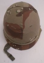 A US M1 helmet with chocolate chip camo