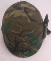 A Vietnam era US M1 helmet with grenade
