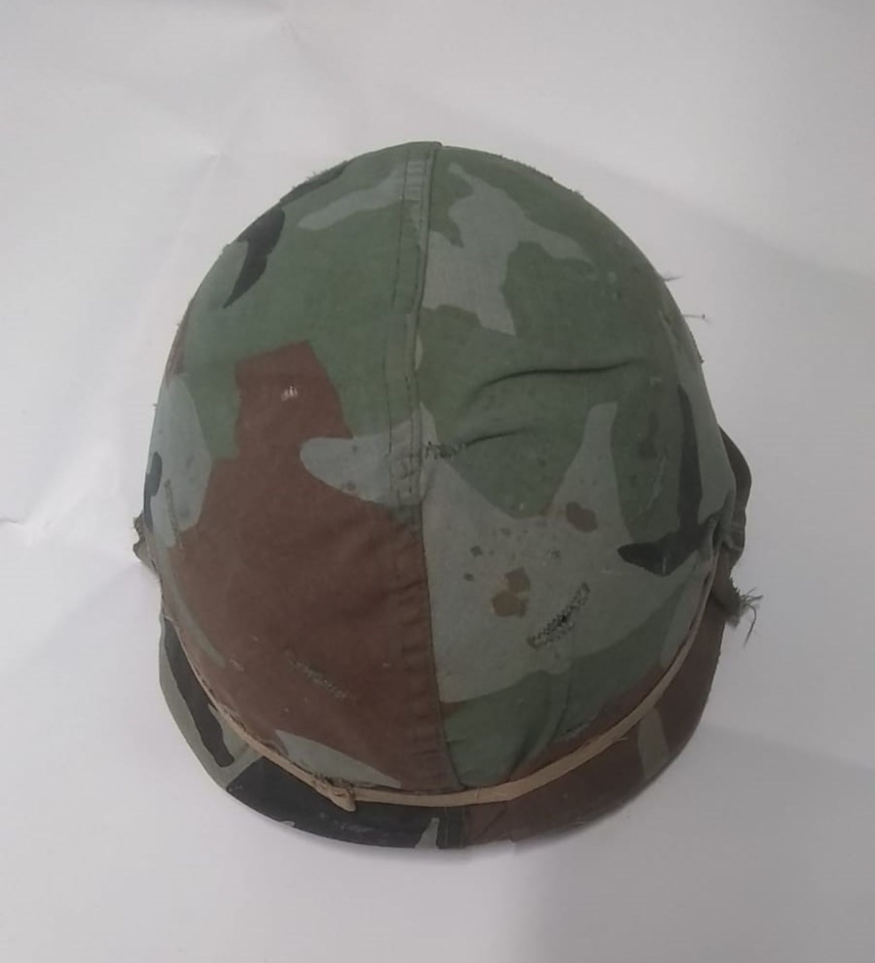 A 1980's US M1 helmet with liner and woo