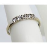 A 9ct gold five stone ring, hallmarked 375, size K-L, 1.1g.