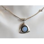 An opal and silver bead necklace in the Native American Navajo style.