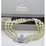 A Vivienne Westwood three row bas relief faux pearl choker, presented in original box,