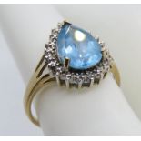 A 9ct gold cocktail ring having large teardrop shaped blue stone in claw setting, hallmarked 375,