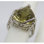 A silver solitaire cocktail ring having pierced gallery and triform stone, stamped 925, size O.