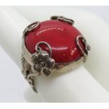 A filigree style silver and red stone boho ring, stamped 925, size N.
